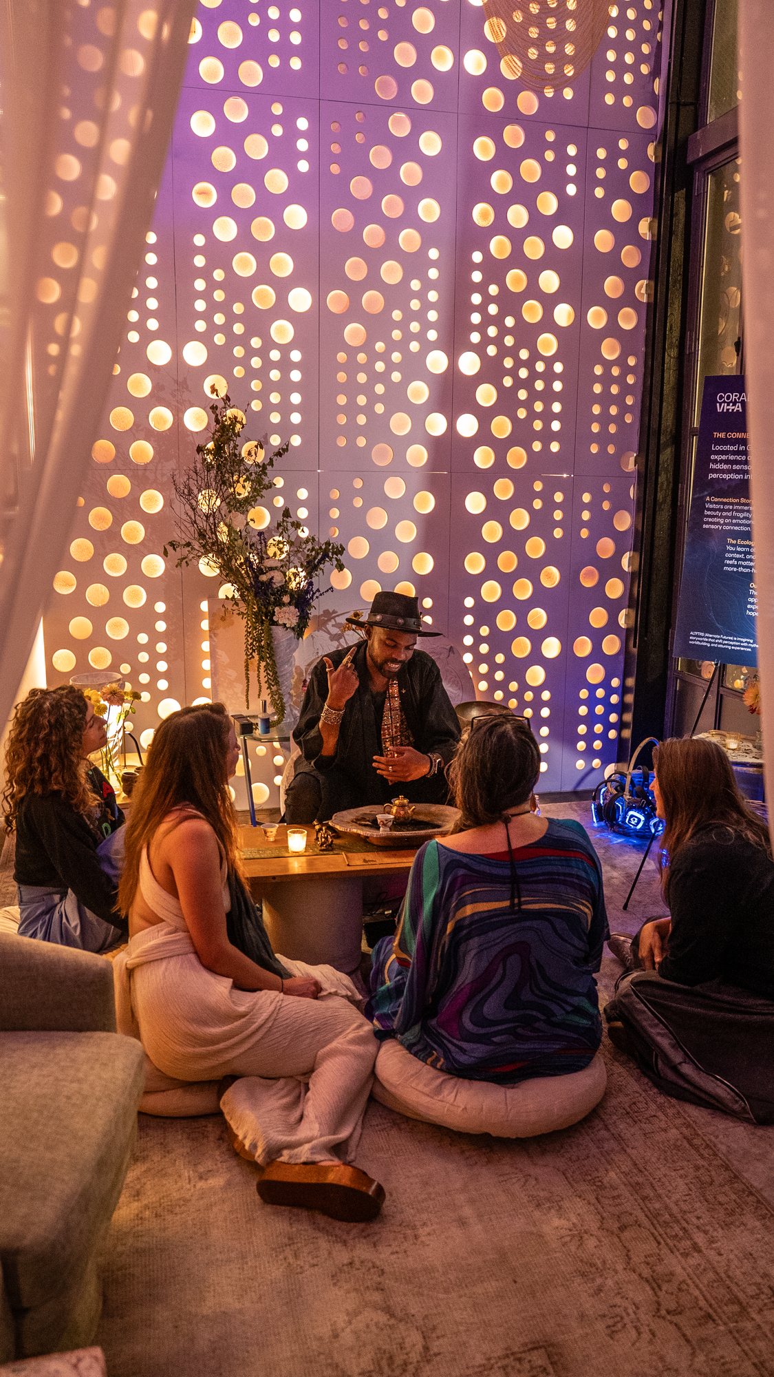 Guests gathered in the candlelit lounge