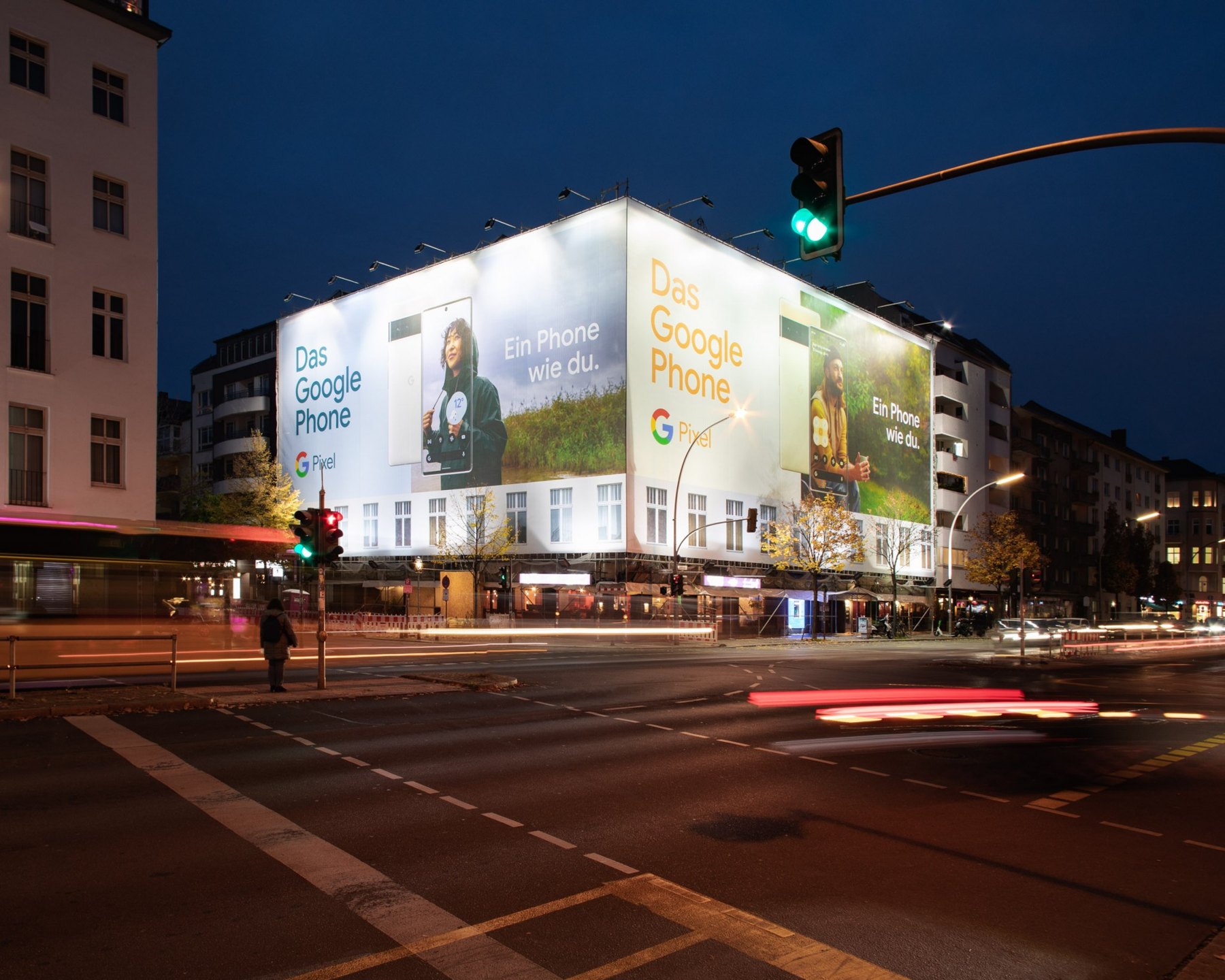 Google Pixel billboard in Berlin at night